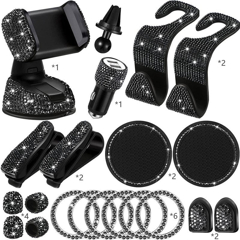 Collection of car accessories with bling, including a phone holder, air vent clip, and coasters.