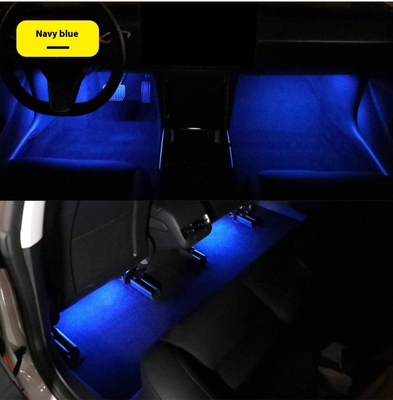 Magnetic Ambient Module displaying navy blue LED ambient lighting in car footwell and rear seats