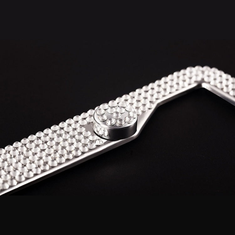 Close-up of Luxury Diamond License Frame showing crystal detailing and screw cap, perfect for elegant car customization.