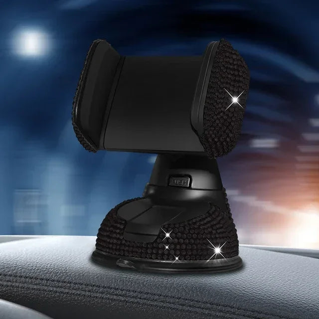 Black crystal rhinestone phone holder with suction cup base on car dashboard