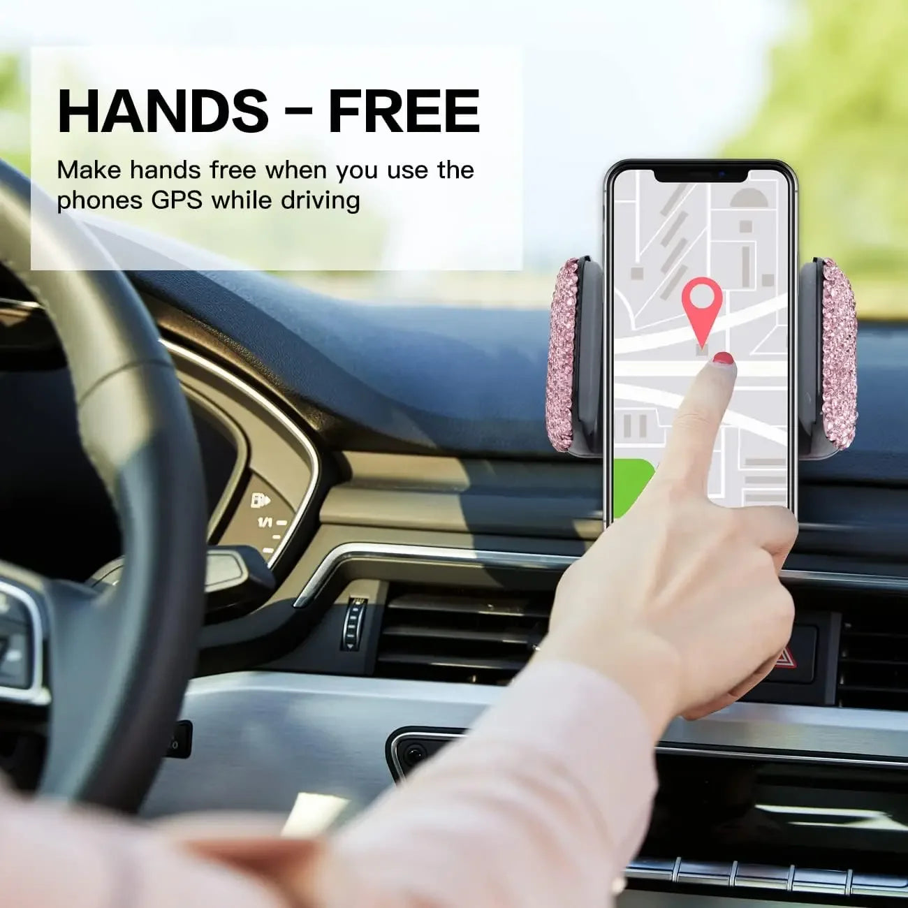 Pink crystal rhinestone phone holder mounted on car air vent