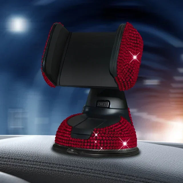Red crystal rhinestone phone holder with suction cup base on car dashboard