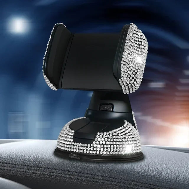 Silver crystal rhinestone phone holder with suction cup base on car dashboard