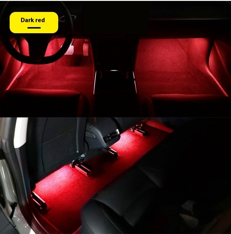 Magnetic Ambient Module displaying red LED ambient lighting in car footwell and rear seats