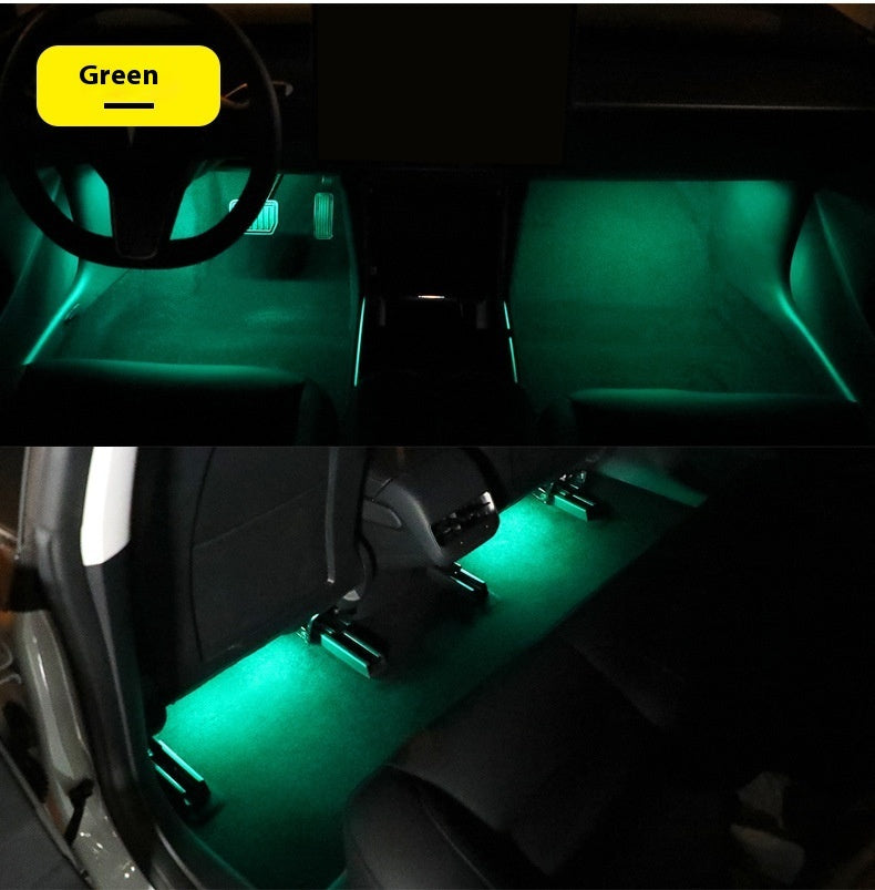 Magnetic Ambient Module displaying green LED ambient lighting in car footwell and rear seats