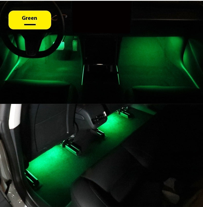 Magnetic Ambient Module displaying green LED ambient lighting in car footwell and rear seats